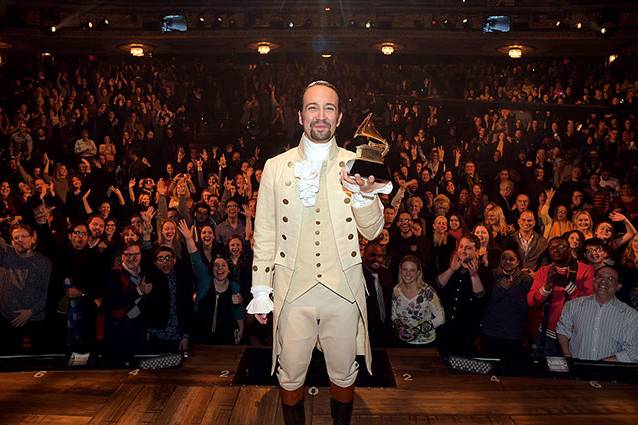 "Hamilton" mastermind Lin-Manuel Miranda celebrates with his Grammy award after a special Grammys performance